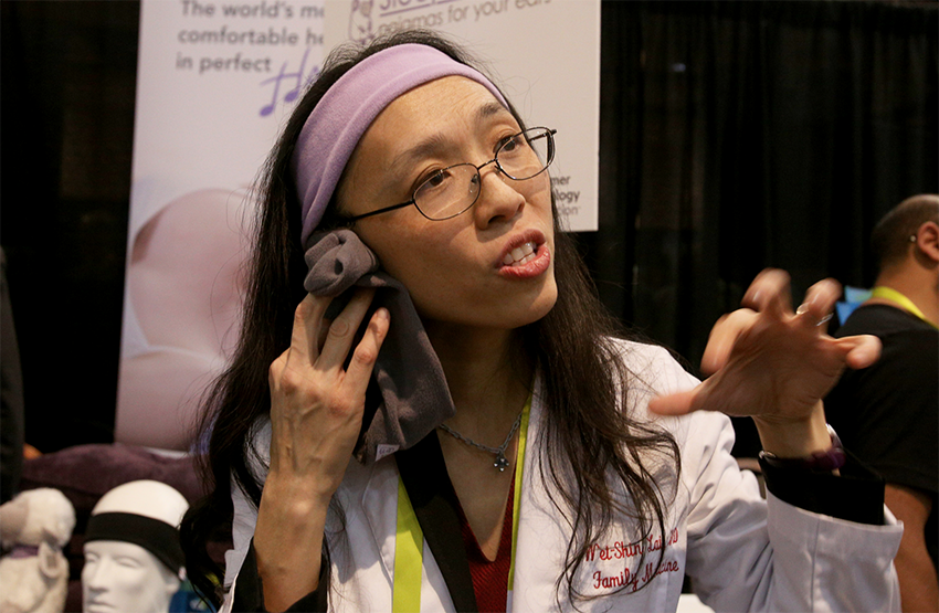 AcousticSheep CEO Dr. Wei-Shin Lai demonstrating how to use SleepPhones at CES Unveiled
